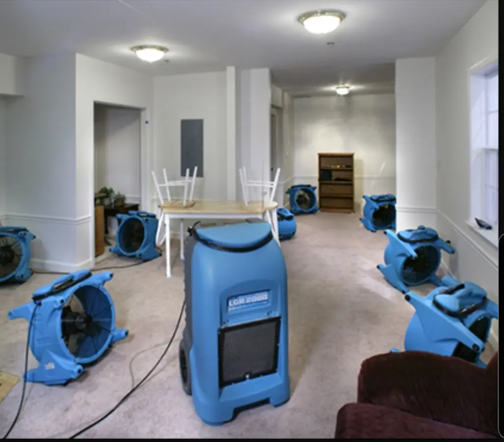Air movers and dehumidifier setup for Water Damage Restoration in Kennedy
